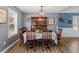 Dining room with decorative lighting and a full table setting for six guests at 248 Christian Circle, Carrollton, GA 30116