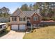 Charming two-story home with a combination of brick and siding, featuring a welcoming front porch at 248 Christian Circle, Carrollton, GA 30116