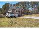 Charming two-story home with vinyl and brick facade, featuring a garage and inviting front yard at 248 Christian Circle, Carrollton, GA 30116