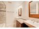 Bathroom with double sinks, tile flooring, and a combined shower and tub at 4983 Odins Way, Marietta, GA 30068