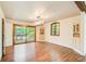 Dining room with hardwood floors, modern chandelier, and doors to deck at 4983 Odins Way, Marietta, GA 30068