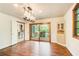 Dining room with hardwood floors, modern lighting, with a doorway view to the kitchen at 4983 Odins Way, Marietta, GA 30068