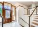 Foyer featuring decorative glass in the front door and stairway with glass panels at 4983 Odins Way, Marietta, GA 30068