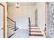 Bright foyer with stairs leading up and down, featuring tile flooring and decorative glass at 4983 Odins Way, Marietta, GA 30068