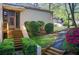 Inviting front entrance with a decorative door, manicured bushes and stone walkway at 4983 Odins Way, Marietta, GA 30068