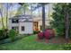 Charming two-story home featuring lush landscaping, mature trees, and a welcoming entrance at 4983 Odins Way, Marietta, GA 30068
