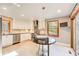 A brightly lit kitchen is complete with stainless steel appliances, and a stylish island table at 4983 Odins Way, Marietta, GA 30068