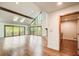 Expansive living room with hardwood floors, stone fireplace, skylights and access to back deck at 4983 Odins Way, Marietta, GA 30068