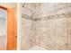 Shower featuring tile surround and glass tile accent at 4983 Odins Way, Marietta, GA 30068
