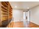 Office with built-in wooden bookshelves and hardwood floors at 4983 Odins Way, Marietta, GA 30068