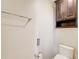 Modern bathroom featuring a toilet and mounted cabinet at 4983 Odins Way, Marietta, GA 30068