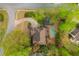 Aerial view of a landscaped property with a kidney-shaped pool, mature trees, and circular driveway at 730 Denmead Se Ml, Marietta, GA 30067