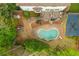 Aerial view of a backyard featuring a kidney-shaped pool, deck, and play area at 730 Denmead Se Ml, Marietta, GA 30067