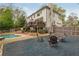 Backyard featuring an in-ground pool, fire pit, and patio with outdoor seating at 730 Denmead Se Ml, Marietta, GA 30067