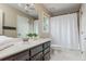 Standard bathroom with a shower, toilet, and double vanity with lots of storage at 730 Denmead Se Ml, Marietta, GA 30067