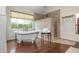 Bright bathroom features a tub, shower, and bright windows at 730 Denmead Se Ml, Marietta, GA 30067