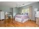 Comfortable bedroom with a vanity, ensuite bathroom, and hardwood floors at 730 Denmead Se Ml, Marietta, GA 30067