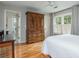 Spacious bedroom with a double door closet, ensuite bathroom, and hardwood floors at 730 Denmead Se Ml, Marietta, GA 30067