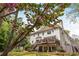 Exterior view of a two-story home with a large deck and landscaped backyard at 730 Denmead Se Ml, Marietta, GA 30067