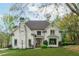 Stunning two-story home with a brick facade, well-manicured lawn, and mature trees creating a picturesque curb appeal at 730 Denmead Se Ml, Marietta, GA 30067