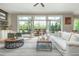 Open living room with access to the rear deck, refined furnishings, and plenty of natural light at 730 Denmead Se Ml, Marietta, GA 30067