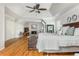 Spacious main bedroom with a fireplace, sitting area, hardwood floors, and tray ceilings at 730 Denmead Se Ml, Marietta, GA 30067