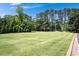 Expansive green field, ideal for recreational activities and community events at 730 Denmead Se Ml, Marietta, GA 30067
