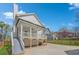 Back exterior view featuring a porch, stairs, and a well-maintained lawn at 3055 Alston Dr, Decatur, GA 30032