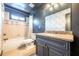 Stylish bathroom with dark blue walls, patterned wallpaper, and a vanity at 3055 Alston Dr, Decatur, GA 30032