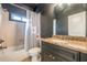 Bathroom featuring granite countertop vanity and tub with decorative shower curtain at 3055 Alston Dr, Decatur, GA 30032