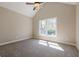 Bright bedroom featuring vaulted ceiling, ceiling fan, and large window at 3055 Alston Dr, Decatur, GA 30032