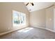 Bright bedroom featuring vaulted ceiling and large window, streaming in sunlight at 3055 Alston Dr, Decatur, GA 30032
