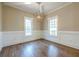 Elegant dining area with hardwood floors, decorative millwork and stylish light fixture at 3055 Alston Dr, Decatur, GA 30032