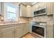 Well-equipped kitchen with stainless steel appliances, granite counters, and natural light at 3055 Alston Dr, Decatur, GA 30032