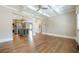 Open-concept living space featuring hardwood floors, coffered ceilings, and seamless access to the kitchen at 3055 Alston Dr, Decatur, GA 30032