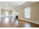 Spacious living room with hardwood floors, large windows, and decorative trim at 3055 Alston Dr, Decatur, GA 30032