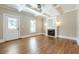 Cozy living room featuring a fireplace, a white coffered ceiling, and rich hardwood floors at 3055 Alston Dr, Decatur, GA 30032