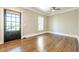 Bright and airy room with hardwood floors and natural light, featuring a glass-paneled door at 3055 Alston Dr, Decatur, GA 30032