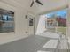 Covered porch with ample space, featuring a ceiling fan and neutral color palette at 3055 Alston Dr, Decatur, GA 30032
