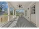 Spacious covered porch with ceiling fan and white railing at 3055 Alston Dr, Decatur, GA 30032
