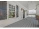 Inviting covered porch with dark shutters and painted wood flooring at 3055 Alston Dr, Decatur, GA 30032