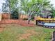 A spacious backyard featuring a deck, manicured landscaping, and a privacy fence at 4103 Christacy Way, Marietta, GA 30066