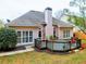 Backyard featuring a deck, well-manicured lawn and a peach colored home at 4103 Christacy Way, Marietta, GA 30066