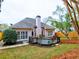 Backyard featuring a deck, well-manicured lawn and a peach colored home at 4103 Christacy Way, Marietta, GA 30066
