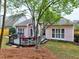 Backyard featuring a deck, well-manicured lawn and a peach colored home at 4103 Christacy Way, Marietta, GA 30066