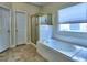 Bathroom featuring a tub, a shower, a neutral color palette and tile flooring at 4103 Christacy Way, Marietta, GA 30066