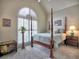 Cozy bedroom with four-poster bed, neutral carpeting and large window at 4103 Christacy Way, Marietta, GA 30066