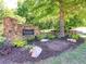 Elegant stone entrance to Thornbrook with lush landscaping and mature trees at 4103 Christacy Way, Marietta, GA 30066