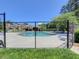 Inviting community pool area with ample lounge chairs, a pergola, and privacy fencing at 4103 Christacy Way, Marietta, GA 30066