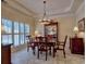 Inviting dining room features a wooden table and chairs under a chandelier, perfect for Gathering dinners at 4103 Christacy Way, Marietta, GA 30066